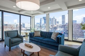 a living room with a blue couch and a table